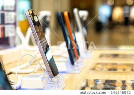 A Display of Modern Smartphones Showcasing Innovative Designs and Technology in a Retail Environment for Enthusiasts and Mobile Users 141246972