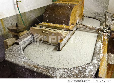 stone trug with pulp in a paper mill 141247072