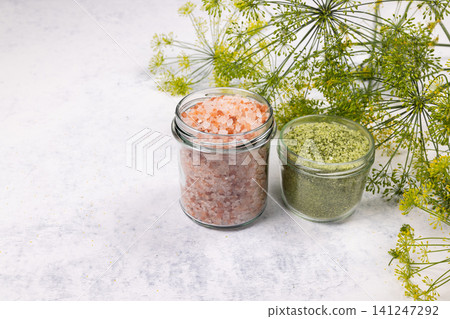 Himalayan pink salt and herb salt in jars with dill Himalayan pink salt and herb salt in jars with dill 141247292