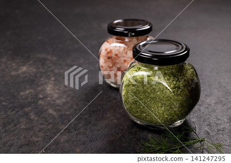 Pink himalayan salt and herbal salt in jars Pink himalayan salt and herbal salt in jars 141247295