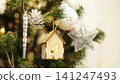 A small wooden house on a Christmas tree 141247493