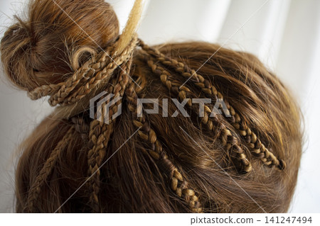 Afro braids in rasta and boho hair styles. Summer hair style. Afro braids in rasta and boho hair styles. Summer hair style. 141247494