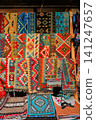 Traditional Balkan Rugs and Ethnic Textiles in Souvenir Shop Display 141247657