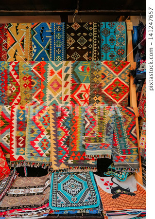 Traditional Balkan Rugs and Ethnic Textiles in Souvenir Shop Display Traditional Balkan Rugs and Ethnic Textiles in Souvenir Shop Display 141247657