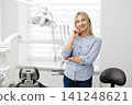 Dentist showing modern dental clinic equipment 141248621