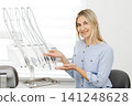 Dentist showing modern dental tools in clinic 141248628