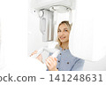 Young woman undergoing a dental panoramic radiography exam 141248631