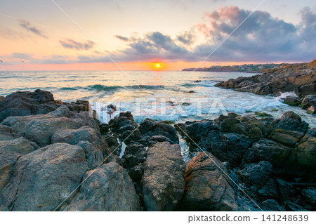 sea landscape at sunrise. rocky coast of bulgaria in summer. dramatic travel background with epic sky sea landscape at sunrise. rocky coast of bulgaria in summer. dramatic travel background with epic sky 141248639