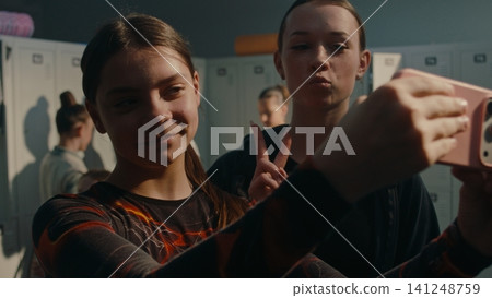 Two Gymnasts Taking Selfie in Locker Room Before Practice Two Gymnasts Taking Selfie in Locker Room Before Practice 141248759
