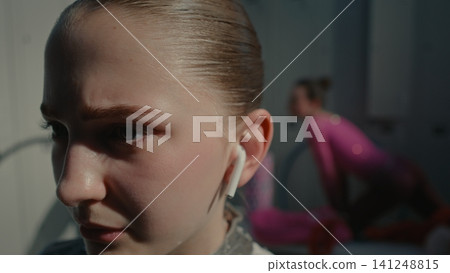 Lonely Teen Gymnast Finding Escape in Music Before Big Performance Lonely Teen Gymnast Finding Escape in Music Before Big Performance 141248815