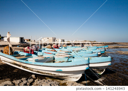 Al Bahadur beach view, Oman landmark. Boats on beach Al Bahadur beach view, Oman landmark. Boats on beach 141248943
