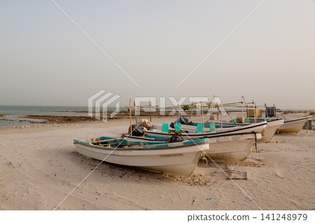 View of Al Khaluf beach with boats aground, Oman View of Al Khaluf beach with boats aground, Oman 141248979