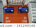 Warsaw, Poland, May 10 2018: Departure screen at gate for flight to the USA 141249148