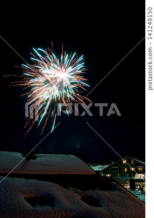 Oberstaufen, Germany, January 01 2018: New Year fireworks in the night sky Oberstaufen, Germany, January 01 2018: New Year fireworks in the night sky 141249150