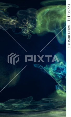 Green and blue translucent smoke wisps on a dark background, creating a mysterious abstract energy composition. 141249223