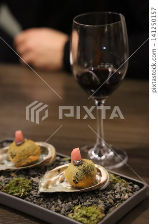 Gourmet Oyster Appetizers with Wine Glass Gourmet Oyster Appetizers with Wine Glass 141250157