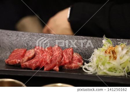 Sliced Beef and Vegetables on Stone Plate Sliced Beef and Vegetables on Stone Plate 141250162