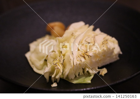 Artfully Presented Cabbage Dish with Garnish Artfully Presented Cabbage Dish with Garnish 141250163