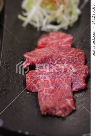 Sliced Wagyu Beef on Slate Plate with Shredded Vegetables 141250169