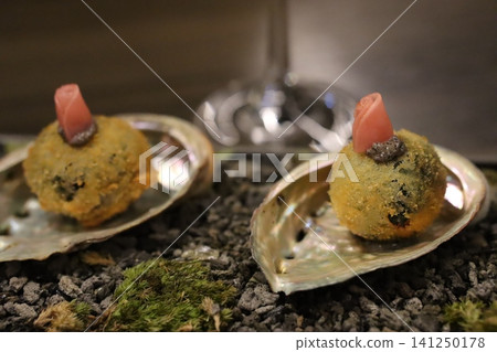 Fried Appetizers on Shell Plates with Ham Garnish Fried Appetizers on Shell Plates with Ham Garnish 141250178