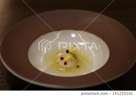 Elegant Shrimp Dish on Artisan Plate 141250182