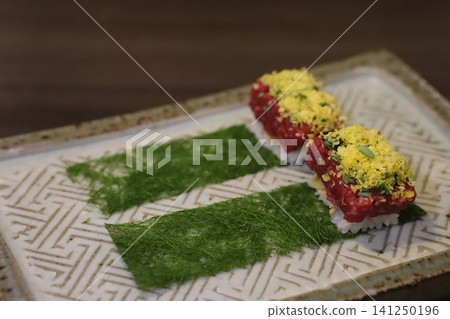 Garnished Beef Sushi on Decorative Plate Garnished Beef Sushi on Decorative Plate 141250196