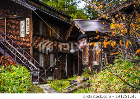 Entrance to a wooden mountain hut in Oze (Autumn) Entrance to a wooden mountain hut in Oze (Autumn) 141251145