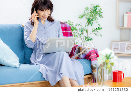 Middle woman using a personal computer Middle woman using a personal computer 141251280