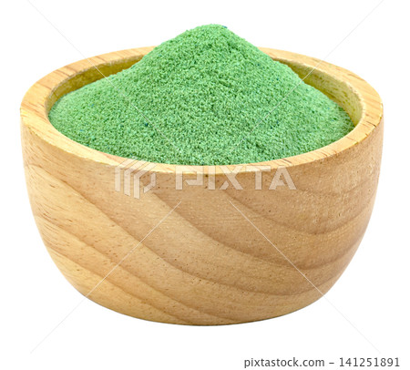 Fine green matcha or spirulina powder in a small wooden bowl isolated. Organic superfood ingredient for healthy drinks, smoothies, and herbal wellness. Professional studio shot. Fine green matcha or spirulina powder in a small wooden bowl isolated. Organic superfood ingredient for healthy drinks, smoothies, and herbal wellness. Professional studio shot. 141251891