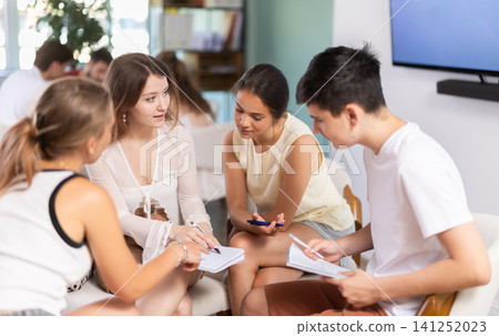 Two teams debating and discussing in classroom circle arrangement Two teams debating and discussing in classroom circle arrangement 141252023