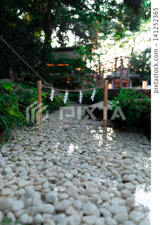 Kawagoe Hikawa Shrine: A sacred stream of holy water, with white pebbles and a sparkling surface. Kawagoe Hikawa Shrine: A sacred stream of holy water, with white pebbles and a sparkling surface. 141252365