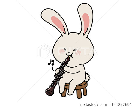 A cute girl playing the oboe A cute girl playing the oboe 141252694