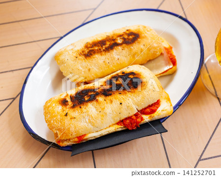 Hot homemade sandwich with chorizo and cheese Hot homemade sandwich with chorizo and cheese 141252701