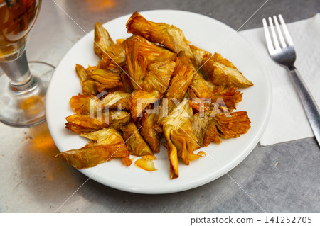 Tasty fried artichokes at white plate, nobody 141252705