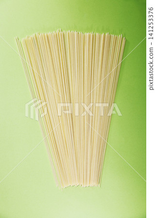 Pasta_Dried Noodles_Light Green Background Pasta_Dried Noodles_Light Green Background 141253376