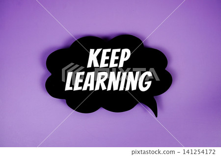 Keep Learning text with speech bubble on purple background Keep Learning text with speech bubble on purple background 141254172