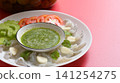 shrimp in fish sauce with Thai spicy seafood dipping sauce on white plate and umeshu 141254275