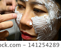 white facial anesthesia cream on face skin of asia woman 141254289