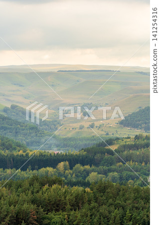 Layers of green mountains and hills in the haze during sunset. Panoramic View of Green hills and Meadow. Layers of green mountains and hills in the haze during sunset. Panoramic View of Green hills and Meadow. 141254316