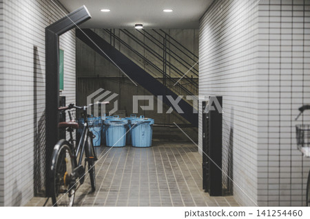 Apartment building common area: bicycle parking area and garbage disposal area Apartment building common area: bicycle parking area and garbage disposal area 141254460