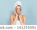 Smiling woman with gold eye masks 141255091