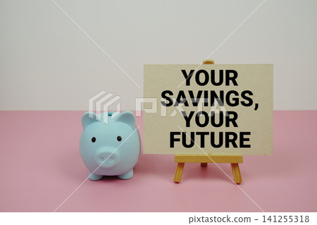 Your Savings, Your Future text written on paper card with easel and piggy bank Your Savings, Your Future text written on paper card with easel and piggy bank 141255318