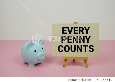 Every Penny Counts text written on paper card with easel and piggy bank Every Penny Counts text written on paper card with easel and piggy bank 141255319