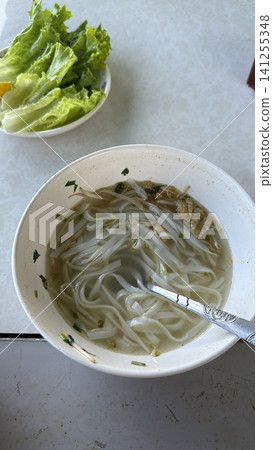 Traditional Vietnamese Pho Noodle Soup with Fresh Lettuce Side Traditional Vietnamese Pho Noodle Soup with Fresh Lettuce Side 141255348