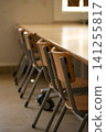 Empty School Classroom With Wooden Chairs and Desks After Class 141255817