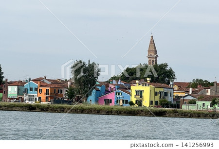 The colorful streets and church bell tower of Burano Island, Venice, Italy The colorful streets and church bell tower of Burano Island, Venice, Italy 141256993