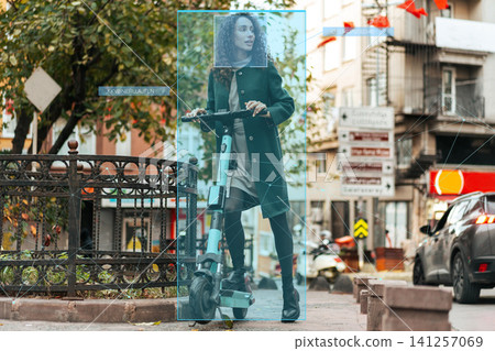 Surveillance system identifies user on electric scooter in urban area during daylight hours Surveillance system identifies user on electric scooter in urban area during daylight hours 141257069