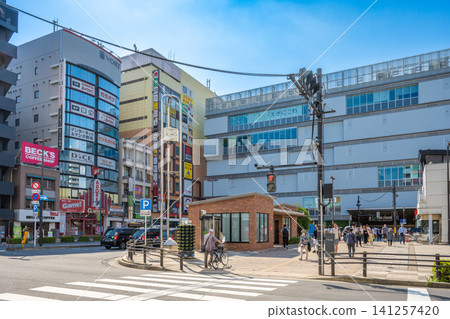A clear, sunny day in front of the south exit of JR Shin-Koiwa Station and the surrounding townscape. A clear, sunny day in front of the south exit of JR Shin-Koiwa Station and the surrounding townscape. 141257420