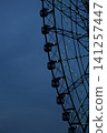 Ferris wheel that shines in the blue sky 141257447