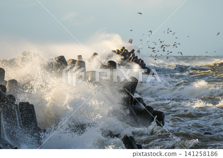 Waves Crash Against Tetrapod Breakwater During Baltic Sea Storm Near Liepaja Coastline Waves Crash Against Tetrapod Breakwater During Baltic Sea Storm Near Liepaja Coastline 141258186